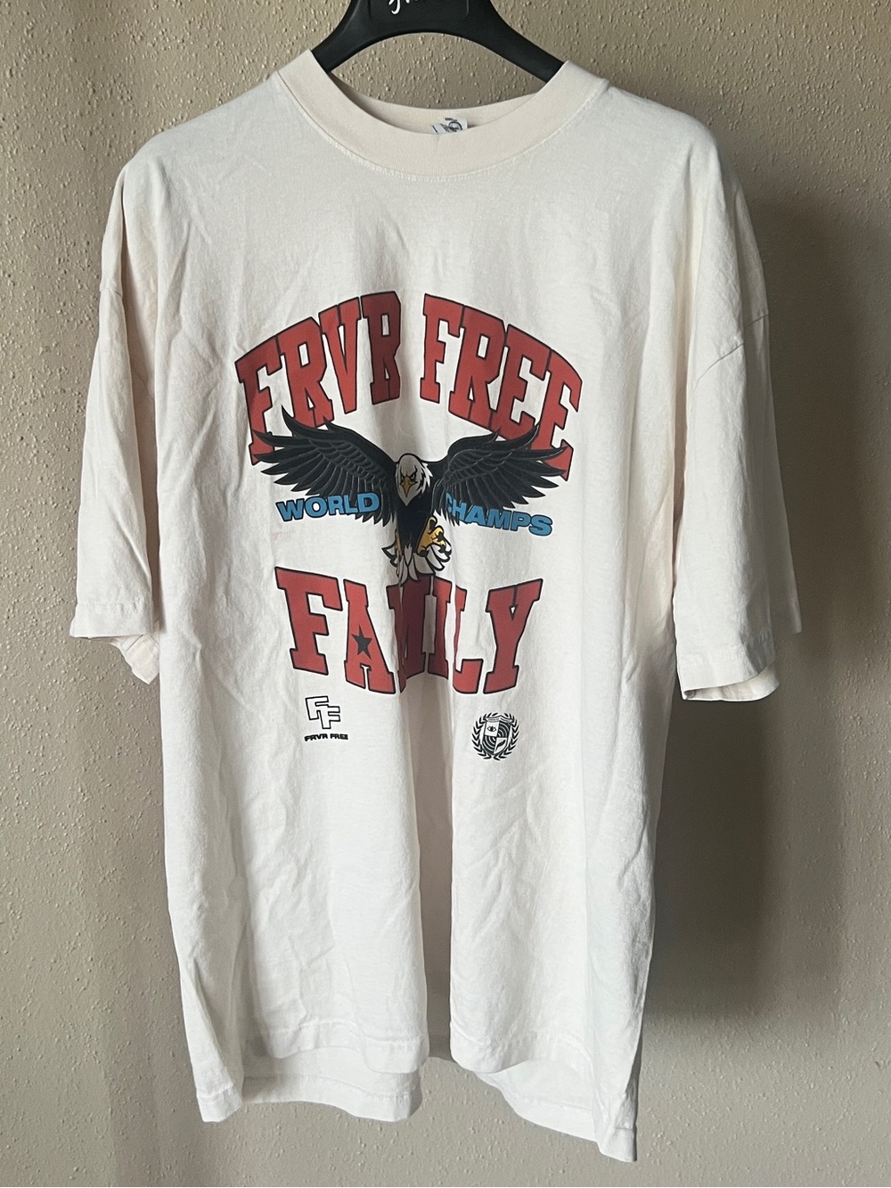 FVRR FREE Cream Graphic Tee with Eagle and “FRVR Free Family” Lettering